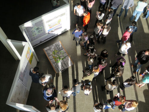 Charrette presentation in the atrium of Temple Buell Hall