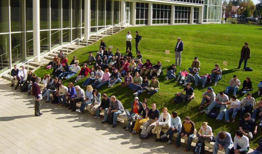 Photo of All-Department Meeting on the patio and grass terraces by Temple Buell Hall