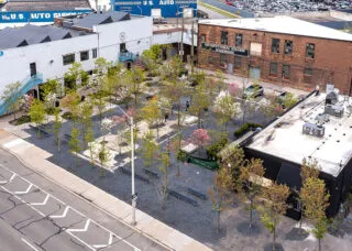 Photo showing transformation of a parking lot in Detroit made possible through depaving