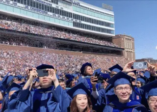 many people in blue graduation robes