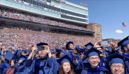many people in blue graduation robes