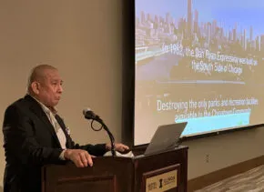 person at podium with mic