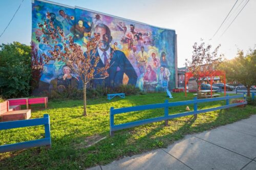 A beautified lot featuring a mural honoring journalist and West Philly native Ed Bradley. Courtesy of Pennsylvania Horticultural Society
