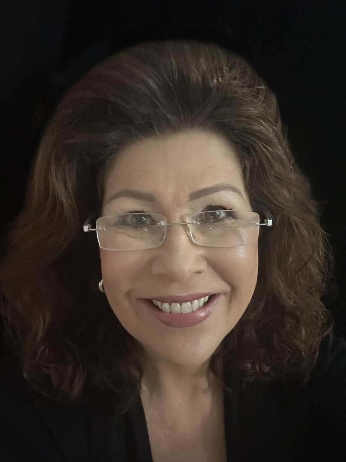 A photo of Dr. Linda Moorhouse, smiling at the camera.