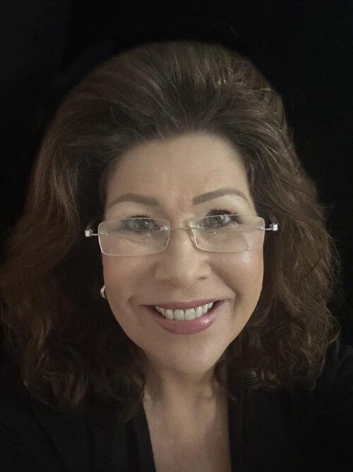 A photo of Dr. Linda Moorhouse, smiling at the camera.