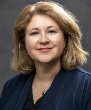 Gayle Magee, woman with shoulder-length hair and blue jacket