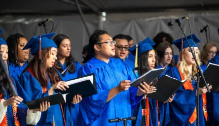 choir members singing at graduation