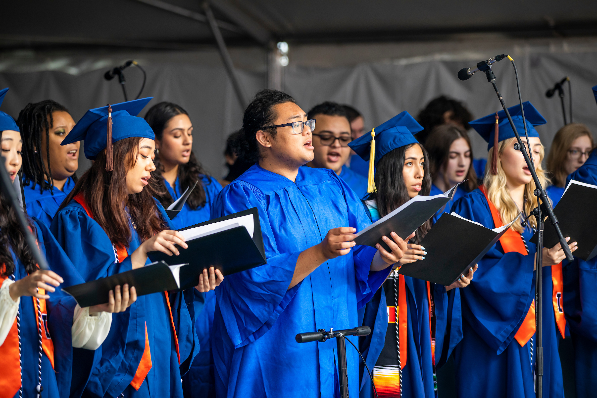 choir members singing at graduation