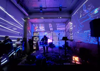 Experimental computer music and visual effects fill the Gallery Art Bar at a PdMaxCon25~ late night session on Sept. 6, 2025 as Mike Moreno performs his DSP Electronic Music Live Set.