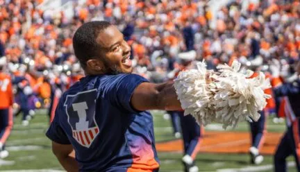 Jeremiah Jordan, junior in FAA, performs alongside the Illinettes dance team at a football game on Sept. 27. Jordan is a dance major, and he is the first male member of the Illinettes. Photo by Sam Rink, The Daily Illini