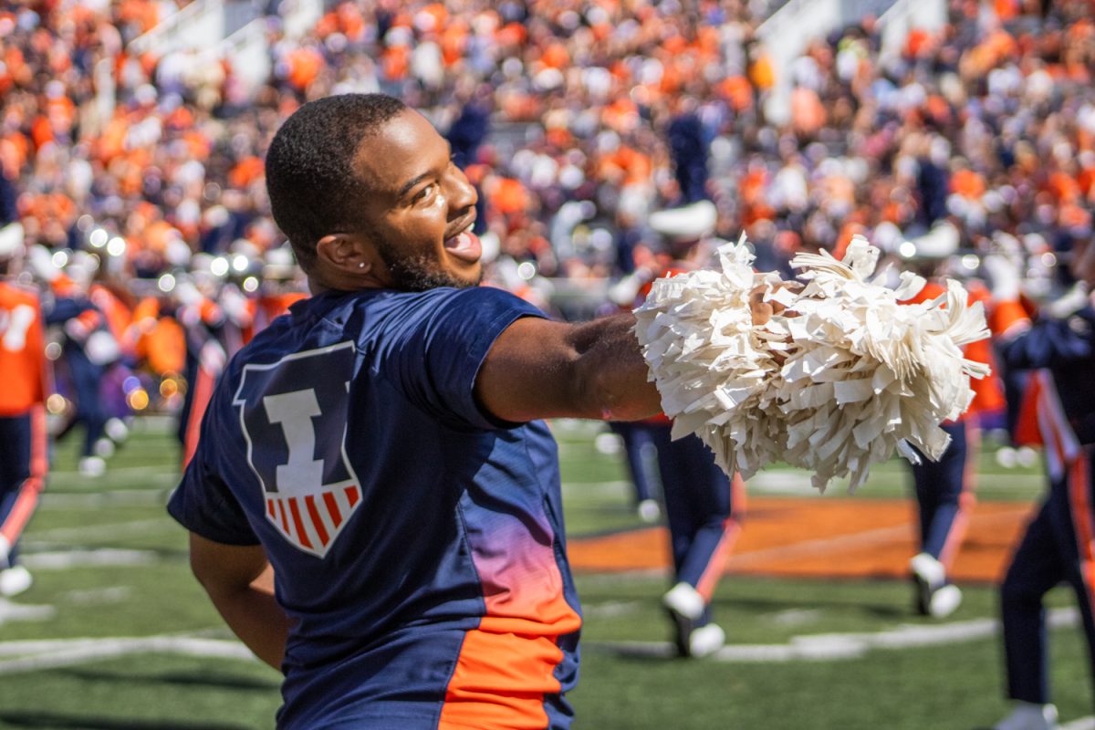 Jeremiah Jordan, junior in FAA, performs alongside the Illinettes dance team at a football game on Sept. 27. Jordan is a dance major, and he is the first male member of the Illinettes. Photo by Sam Rink, The Daily Illini