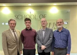 2025 Paul Rolland Competition winner Luke Brann with judges