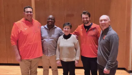 The photo below includes the three wind conducting TAs who conduct Campus Band, Alex Mondragon, JaQuan Wiley, and Beau Bujol, alongside Kathy and director of bands Kevin Geraldi.
