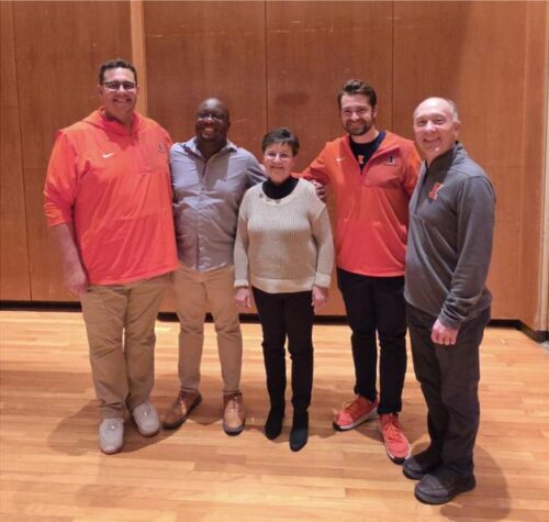 The photo below includes the three wind conducting TAs who conduct Campus Band, Alex Mondragon, JaQuan Wiley, and Beau Bujol, alongside Kathy and director of bands Kevin Geraldi.