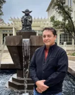 Paul Zinnes in front of Yoda statue fountain at Lucas Arts HQ in San Francisco