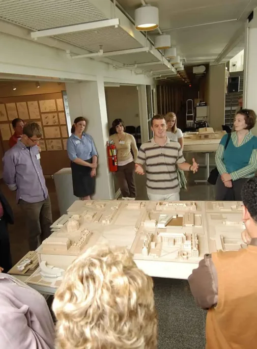 Architecture students looking at a model