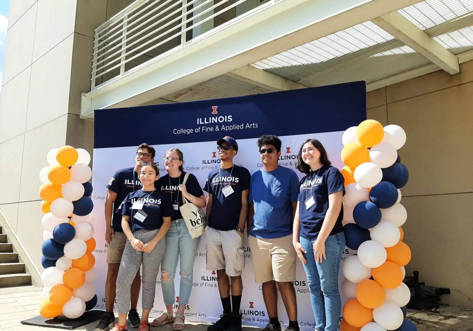 6 students at New Student Welcome standing in front of an FAA backdrop