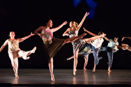 students onstage dancing