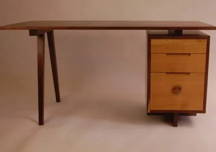 desk table with two legs on one end and 3 drawers on the other