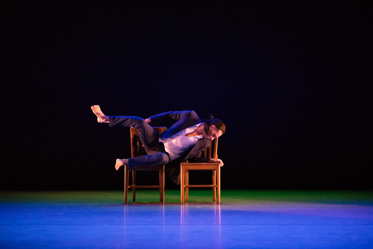 a person dancing on a chair