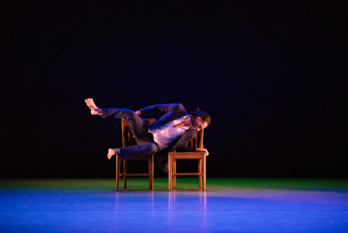 a person dancing on a chair