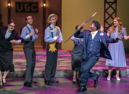Dancing in front of a group in Urinetown, Department of Theatre, November 2022, Photo by Darrell Hoemann