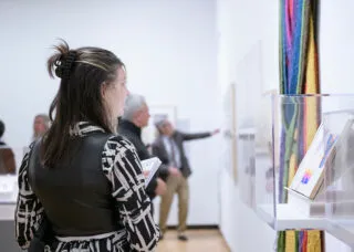 Woman looking at artwork in museum