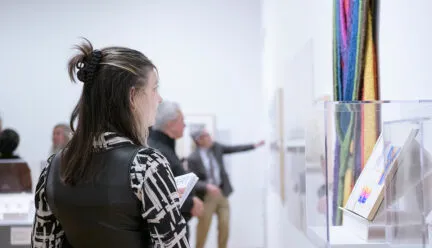 Woman looking at artwork in museum