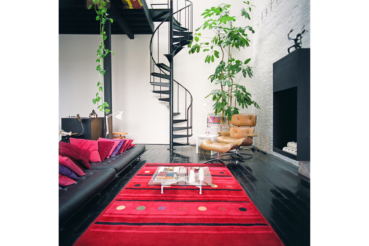 Black stairs with red carpet