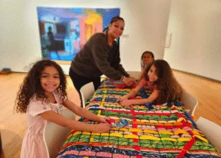 kids doing art activity smiling at camera