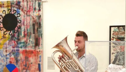 man playing instrument