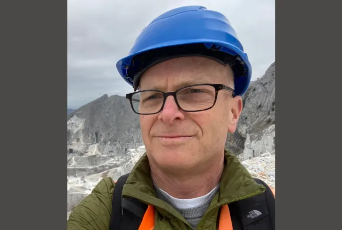 tom leslie wearing a blue hard hat