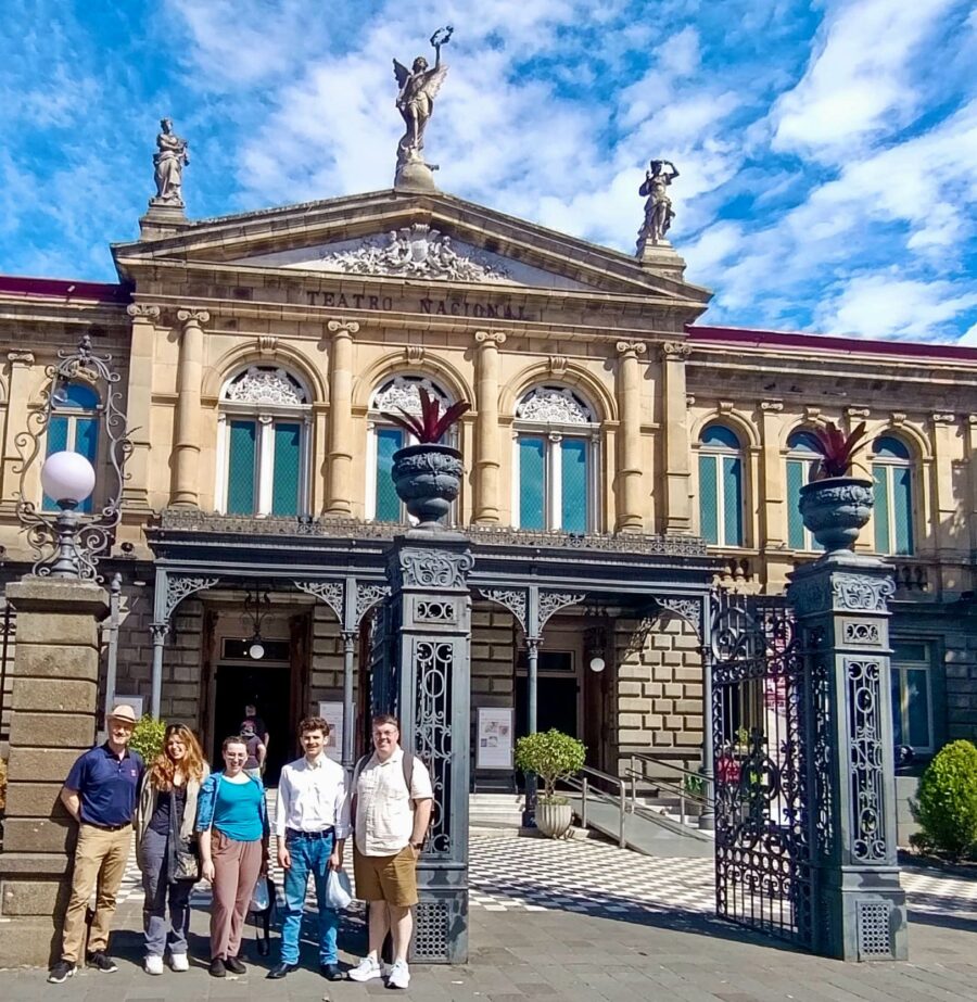 several people standing outside a building