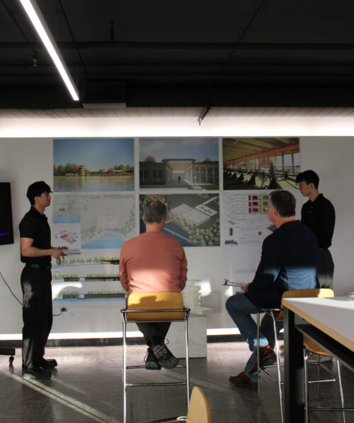 people presenting their posters