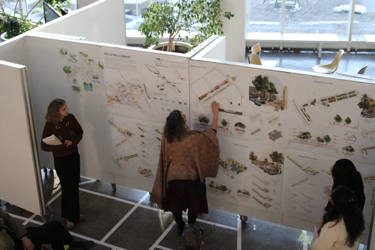 people presenting their posters