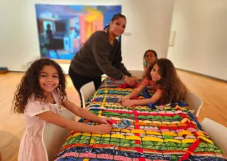 kids artmaking photo smiling at camera