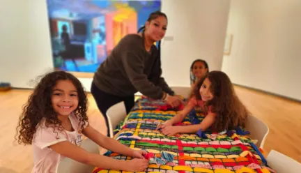 kids artmaking photo smiling at camera