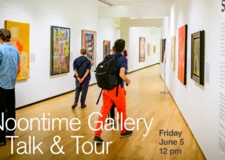 several people walking in a gallery