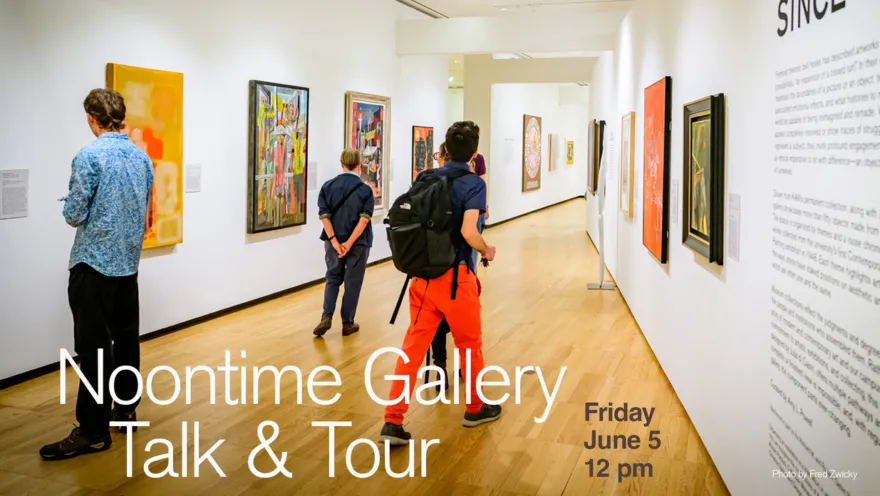 several people walking in a gallery