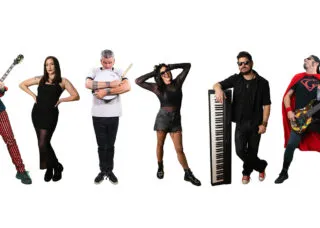 six people with instruments pose in goofy manner