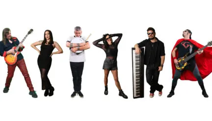six people with instruments pose in goofy manner