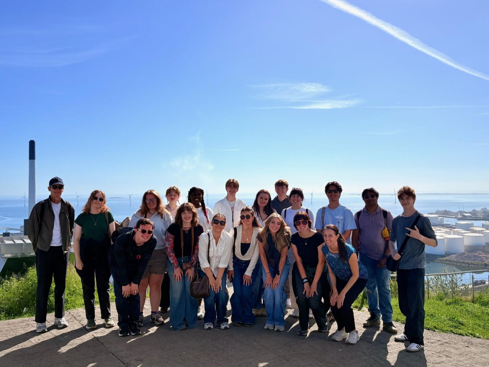 many people gathered outdoors posing for photograph