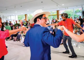 people holding hands and dancing