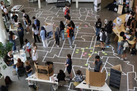 Students browse tables for Architecture student organizations