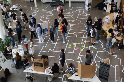 Students browse tables for Architecture student organizations