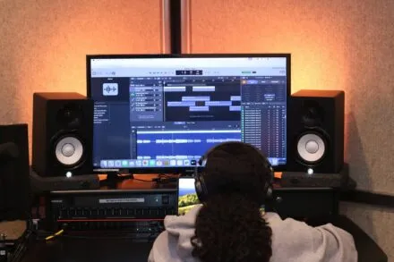 a person works on sound software on computer