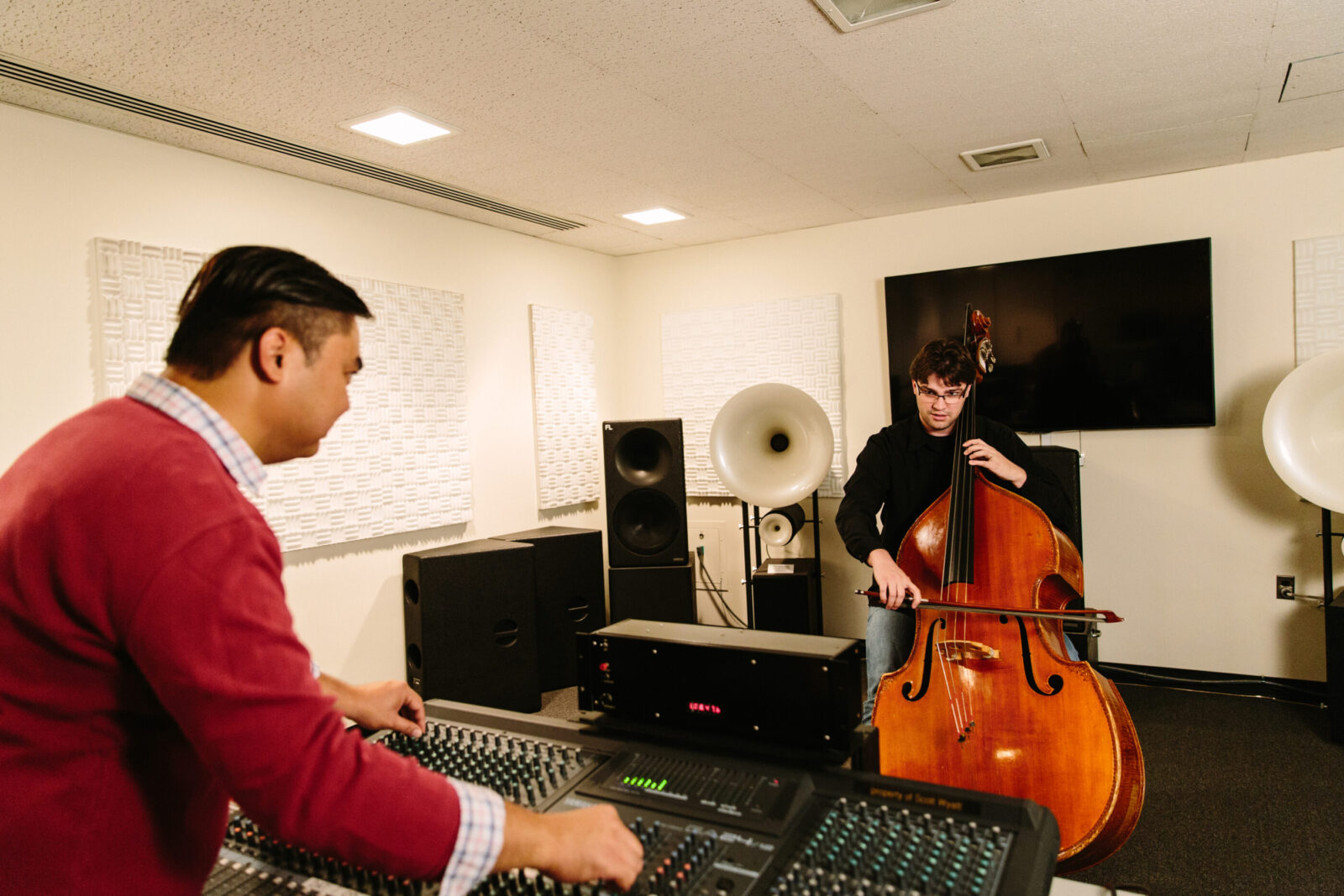 two people in a music studio