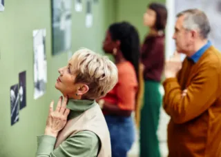 woman looking at art in museum