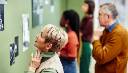 woman looking at art in museum