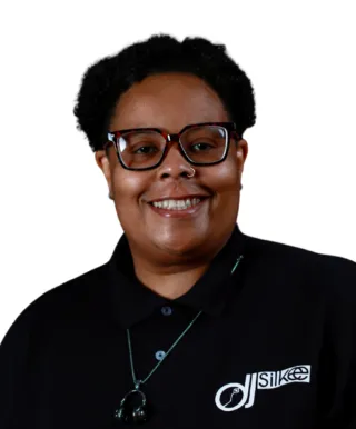 person wearing black shirt and glasses smiling